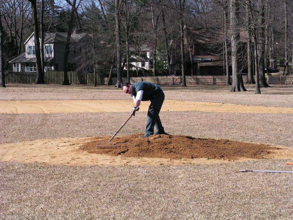 Raking a sand pit